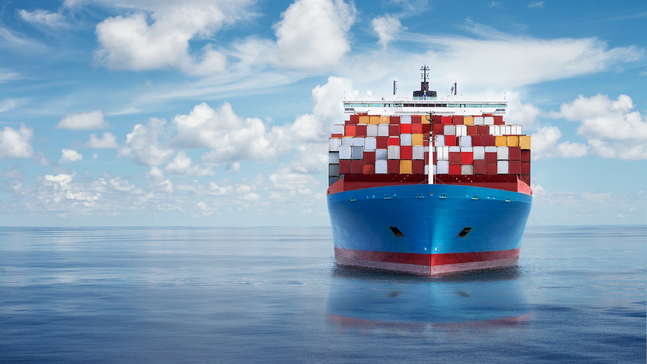 Cargo containers at shipping port — global trade finance services