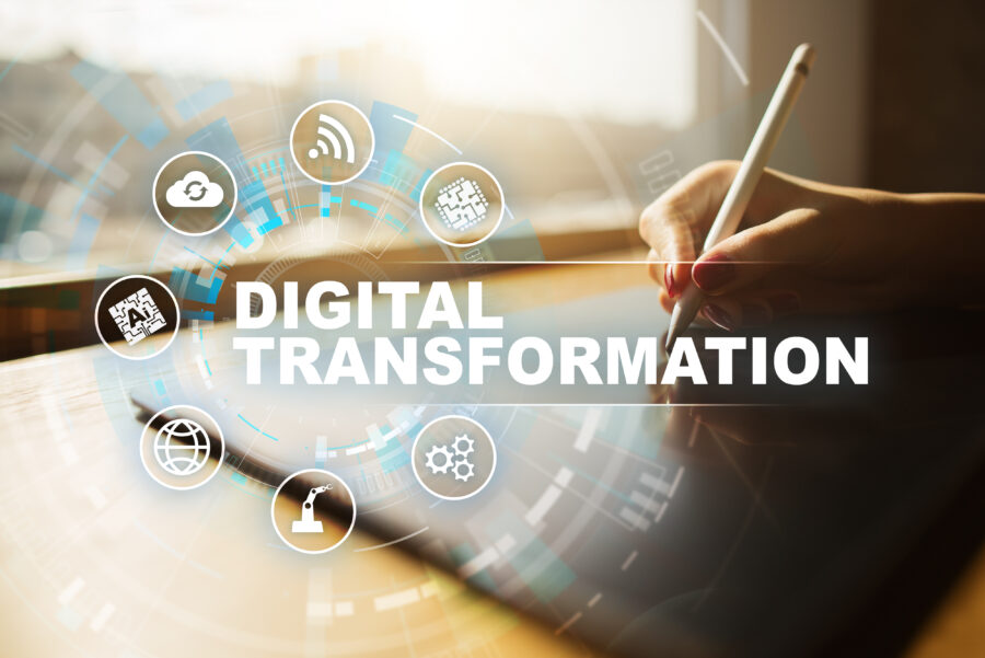 Hand using tablet with digital transformation icons overlay