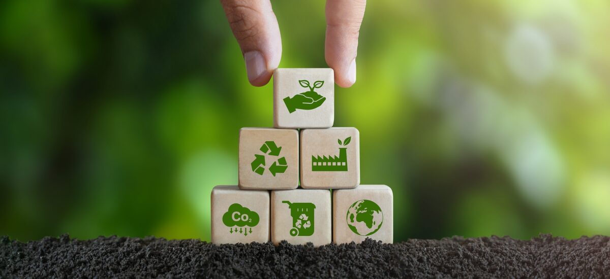 Hand stacking eco blocks in soil